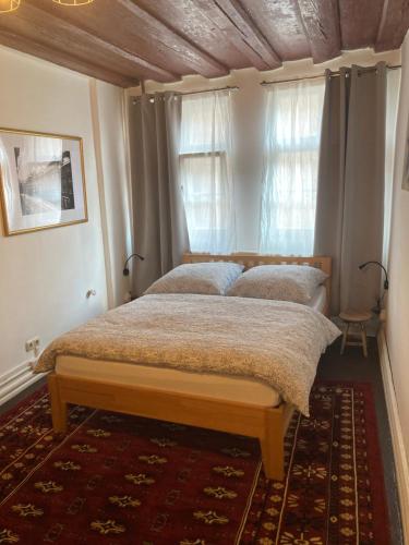 a bedroom with two beds and a window at Zur Baumwolle in Nuremberg
