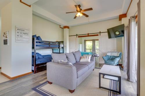 a living room with a couch and a bunk bed at Waterfront Spicewood Home Deck, Fire Pit and Grill in Spicewood