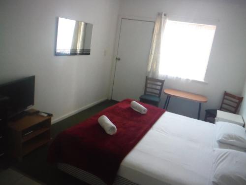 Postel nebo postele na pokoji v ubytování Restawile Motel