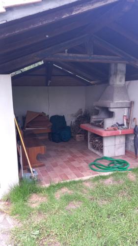 a patio with an outdoor oven in a house at Domus Claudio in Villam in Pomezia