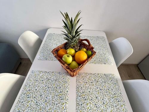 a basket of fruit sitting on a table at Apartment JURIĆ in Lovran