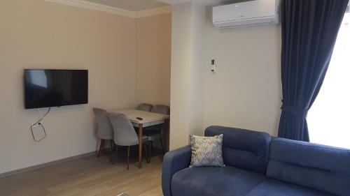 TV a/nebo společenská místnost v ubytování Guest Apart Konaklar