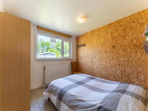 Ένα ή περισσότερα κρεβάτια σε δωμάτιο στο Holiday home in Baarland with garden