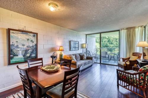 a living room with a table and a couch at Maunaloa Shores 612 in Hilo