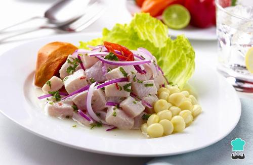 a white plate with a salad and corn and lettuce at Amazon Lodge Varillal in Iquitos