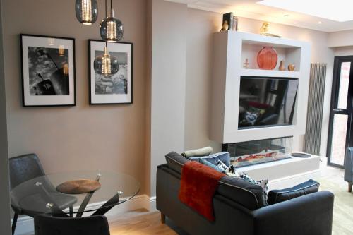 a living room with a couch and a table at York House Hotel in Whitley Bay