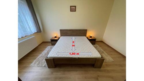 a room with a table with a sign on it at Pyky in Baia Mare