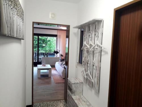 a hallway with a door leading to a living room at Urlaub und Wellness im Fichtelgebirge in Warmensteinach