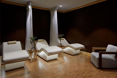 a waiting room with white chairs and a couch at Lancaster Marriott at Penn Square in Lancaster