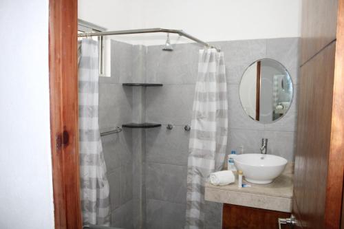 a bathroom with a shower and a sink at Centrico Depto (101) in Cancún
