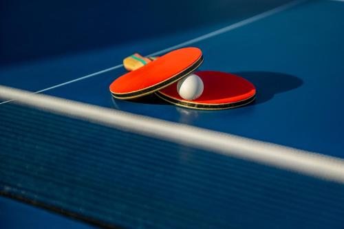 a pair of ping pong balls sitting on top of a table at Pervolia House Private Villa Near Airport in Kremasti