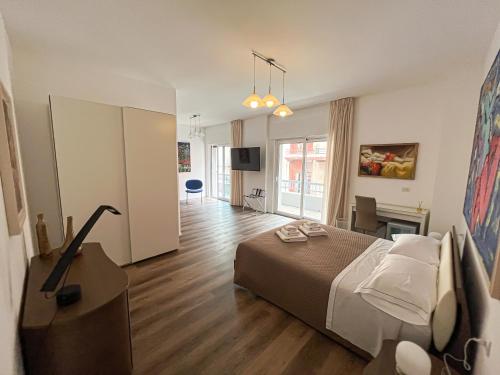 a hotel room with a bed and a television at MELO 48 in Bari