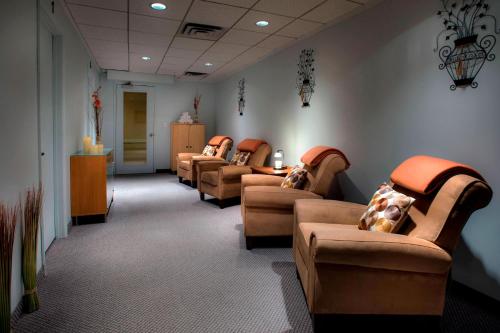 a waiting room with a row of couches and chairs at Princeton Marriott at Forrestal in Princeton