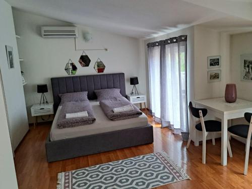 Ένα ή περισσότερα κρεβάτια σε δωμάτιο στο Apartments Thea