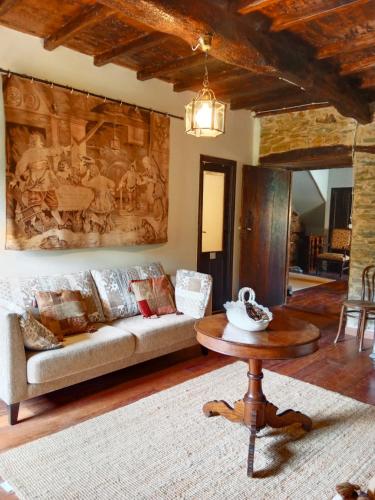 a living room with a couch and a table at Corredoira in Viveiro