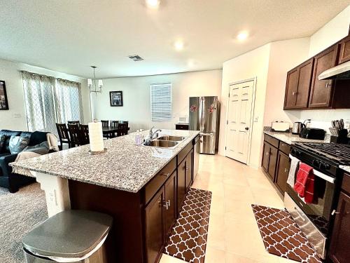 a kitchen with a sink and a counter top at Spacious House, 5 bedrooms, Sleeps 12, Near Las Vegas Strip and Airport in Las Vegas