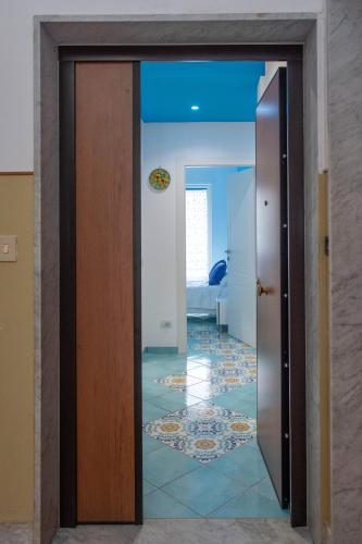 a door leading into a room with a bedroom at Casa Sammarco in Minori