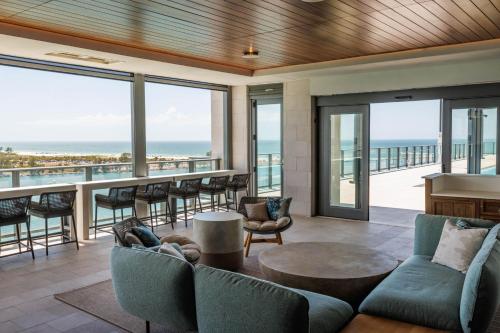 a living room with a view of the ocean at JW Marriott Clearwater Beach Resort & Spa in Clearwater Beach