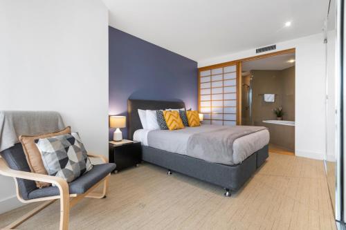 Ένα ή περισσότερα κρεβάτια σε δωμάτιο στο Cotton Beach Resort - Tweed Coast Holidays ®