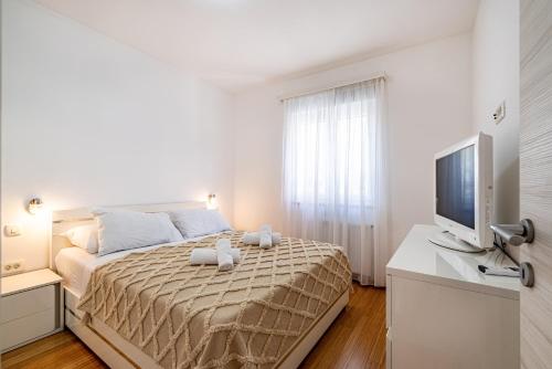 Voodi või voodid majutusasutuse Apartments with a parking space Okrug Gornji, Ciovo - 21440 toas