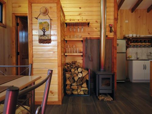 a room with a wood stove in a kitchen at Casa Vacacional Panguipulli in Panguipulli