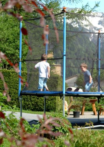 two young boys playing on a playground at Ferienwohnungen Erath in Schoppernau