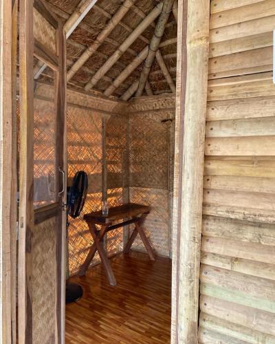 an inside view of a room with a table at Happy Lemon Tree lodge in Sauraha