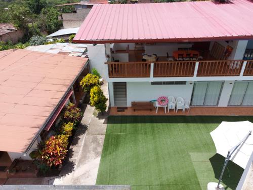 an aerial view of a house with a red roof at Albergue Schuler in San Ramón