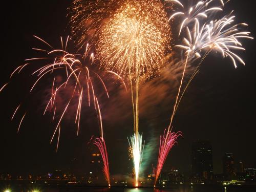 a group of fireworks exploding in the sky at night at Ostay Kitahama Hotel Apartment in Osaka