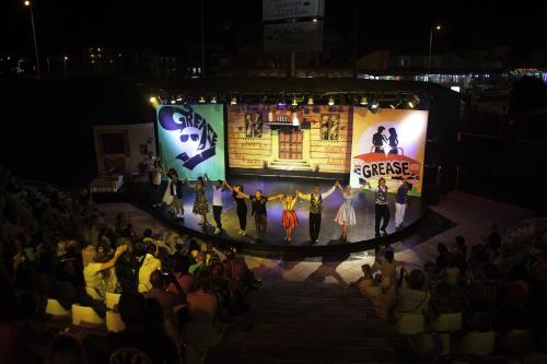 a group of people on a stage at night at Adalya Art Side - Ultra All Inclusive in Side
