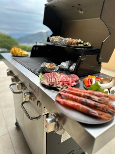 a grill with a plate of food on it at 1日1組限定 展望露天風呂付き 南国リゾート貸切ヴィラ 歩羅无 湯河原 FuranYugawara in Yugawara