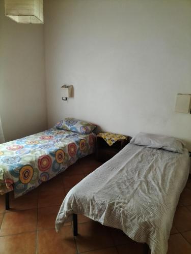 Zimmer mit 2 Betten in einem Zimmer in der Unterkunft Rod Ranch Livestock - Stanza double room in Campagnano di Roma