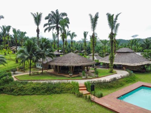 an aerial view of a resort with a swimming pool at Khaosok Boutique Hideaway - Cliff Tent in Khao Sok National Park
