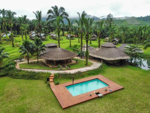 an aerial view of a resort with a swimming pool at Khaosok Boutique Hideaway - Cliff Tent in Khao Sok