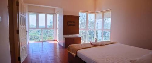 Postel nebo postele na pokoji v ubytování Idam Resort