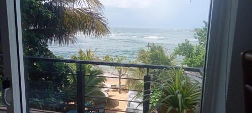 a view of the ocean from a balcony at Toddy by windy in Unawatuna