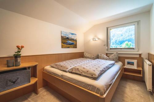 Posteľ alebo postele v izbe v ubytovaní Alpenherz Apartments