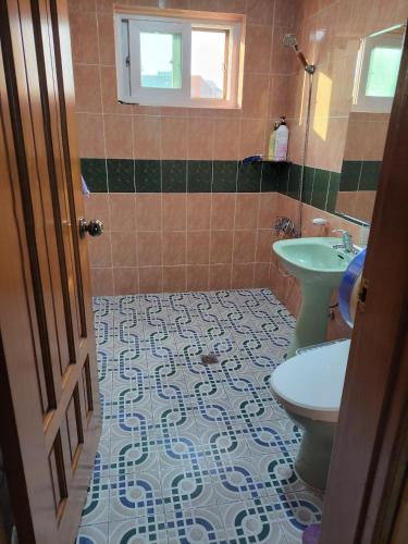 a bathroom with a sink and a toilet at JNW MINBAK in Damyang