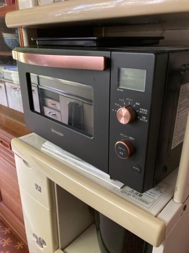 a microwave oven sitting on top of a table at ＯＫＵＮＯ ＩＥ in Oshima