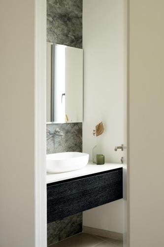 a bathroom with a sink and a mirror at THE Y HOUSE in Jerusalem