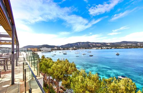 a view of a bay with boats in the water at Leonardo Royal Hotel Mallorca Palmanova Bay in Palmanova