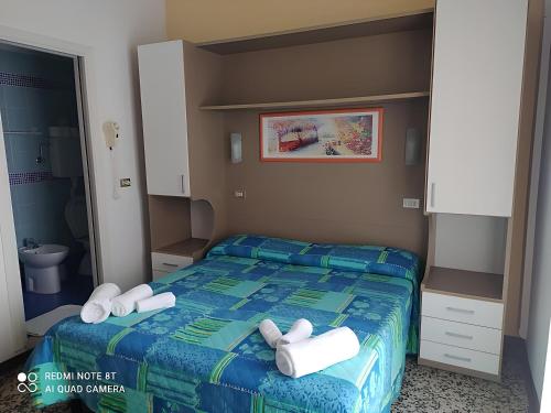 Postel nebo postele na pokoji v ubytování B&B Hotel Villa Nora