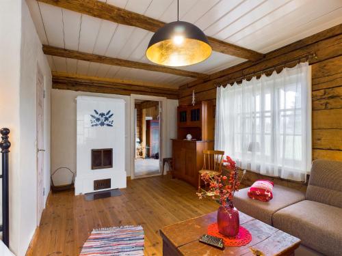 a living room with a couch and a table at Pädaste Välja Apartments in Pädaste