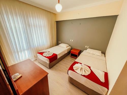 Postel nebo postele na pokoji v ubytování Hotel First Class Didim