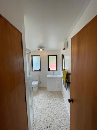 a small bathroom with a toilet and a sink at Ski Pad Methven in Methven