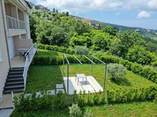 a view of a garden with a bench and stairs at Residence Mancini - Cilento Home & Sunset in Rocca Cilento