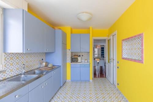 A kitchen or kitchenette at iFlat Margutta Colors on Canvas Apartment