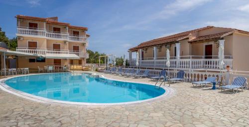 a swimming pool in front of a house at Corfu Panorama by Estia in Moraitika