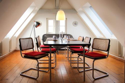 a dining room with a table and chairs at Alter Bahnhof Bresewitz in Bresewitz