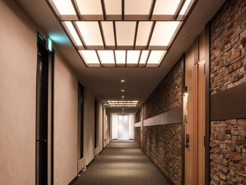 a corridor of an office building with a ceiling at Panorama Niseko in Kutchan